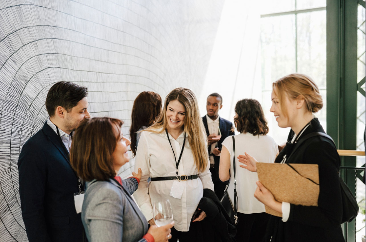 Group of people talking at a conference