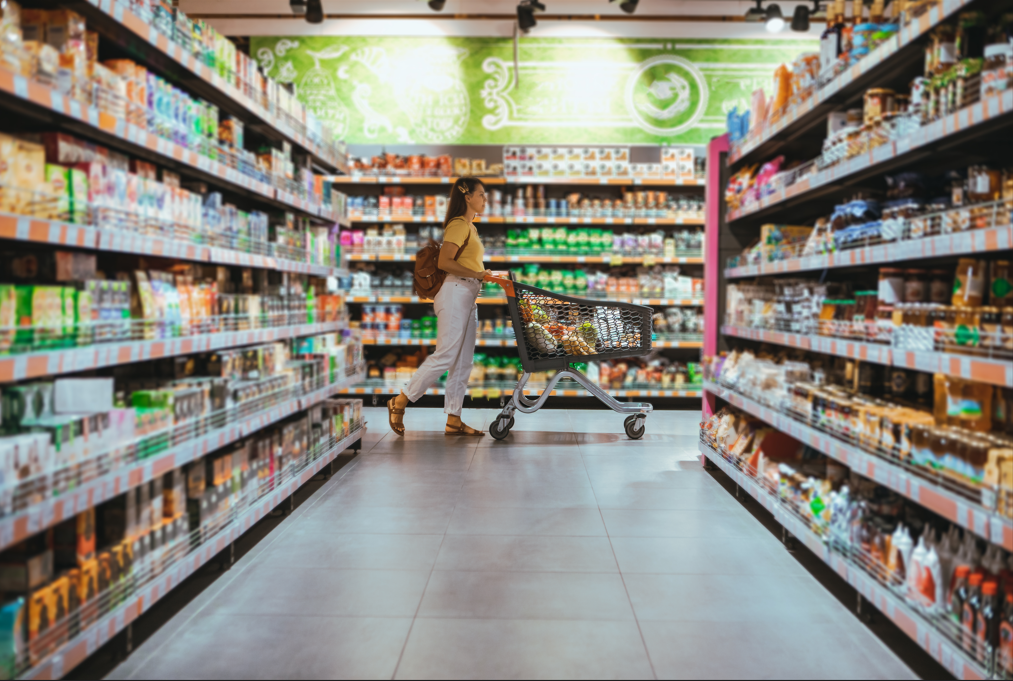 Woman with shopping between store shelf