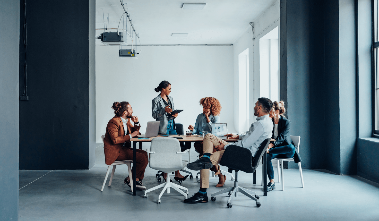 Group Of Businesspeople On A Meeting At Their Company